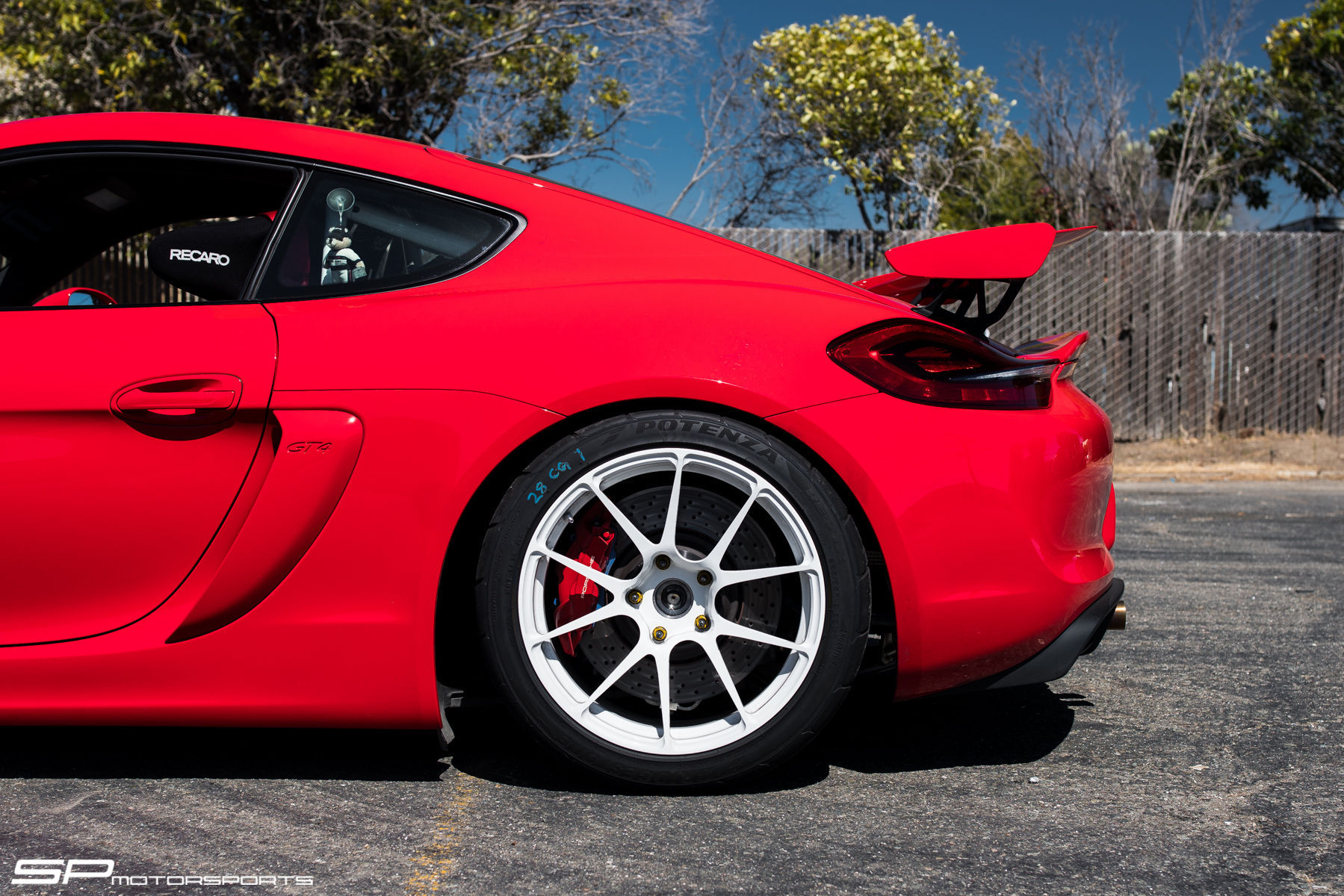 2016 Porsche Cayman | SP Motorsports' Porsche Cayman GT4 Shop Car on Forgeline One Piece Forged Monoblock GA1R Open Lug Wheels