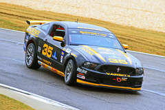 Downhill turning into the apex at Barber Motorsports Park on their fresh Continental Tires.