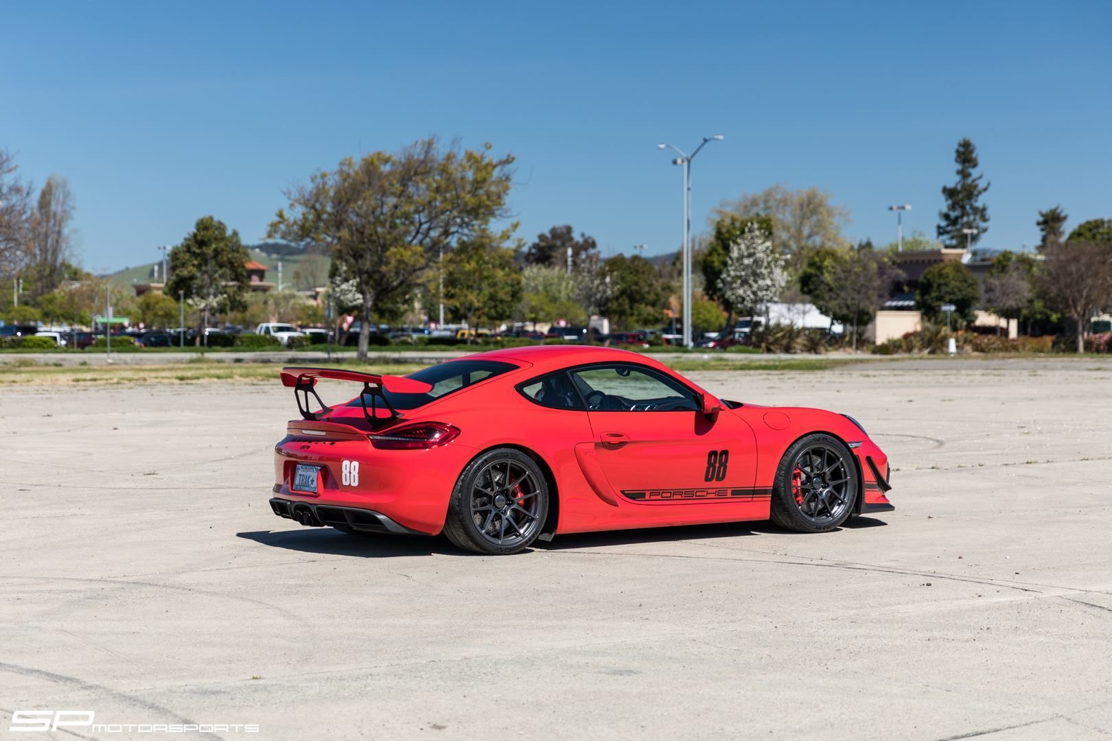 2016 Porsche Cayman | Steve's SP Motorsports Guards Red Porsche Cayman GT4 on Forgeline One Piece Forged Monoblock GA1R Open Lug Wheels