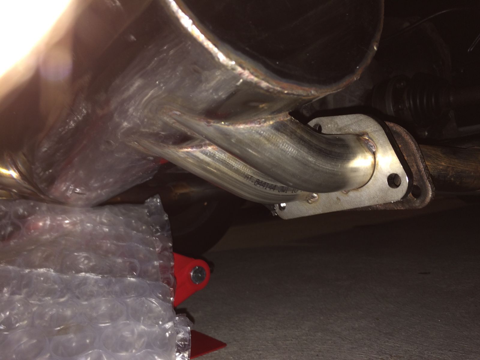 1974 Porsche 914 | Lifting Muffler into place.