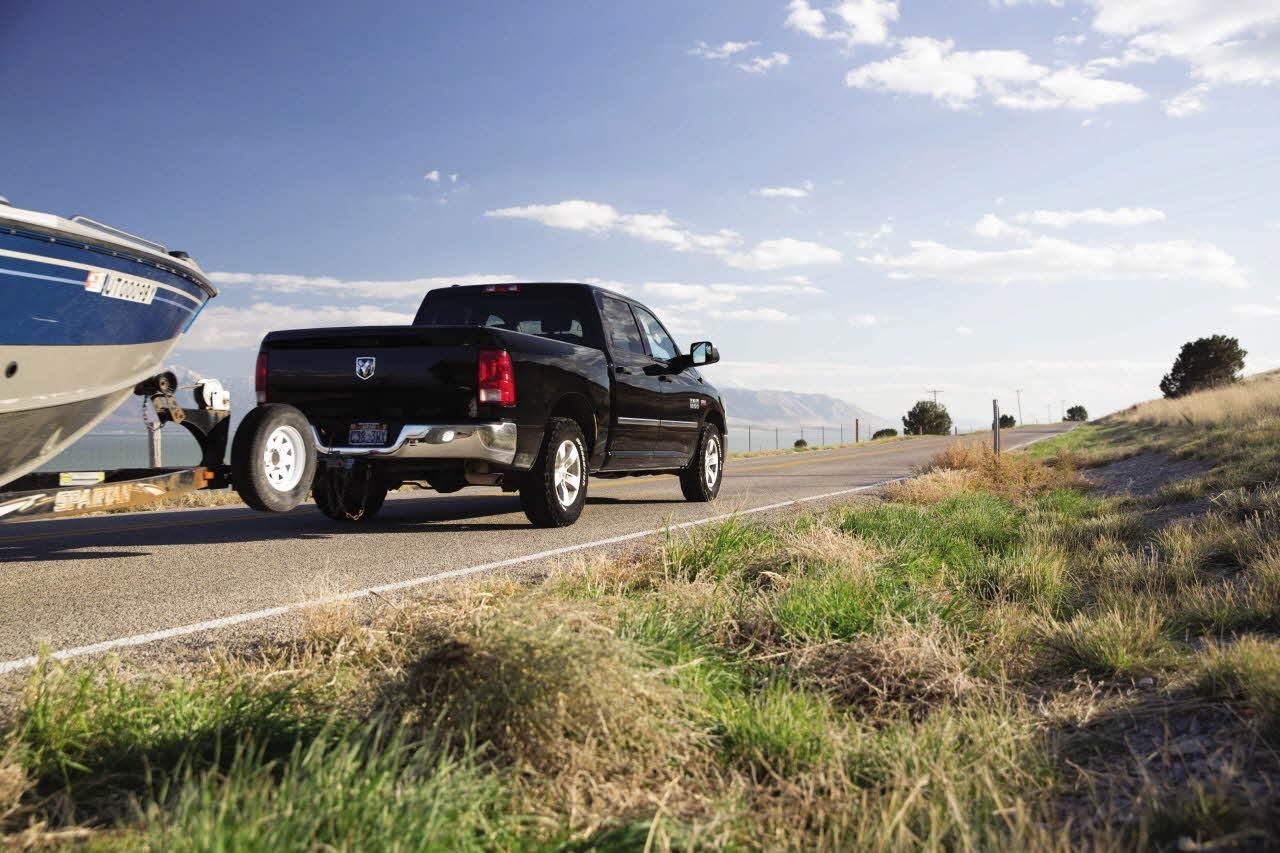Ram | 4x4 Pickup with a Boat in Tow