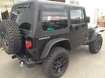 '90 YJ Jeep with lift, wheels, and custom bumper and fenders